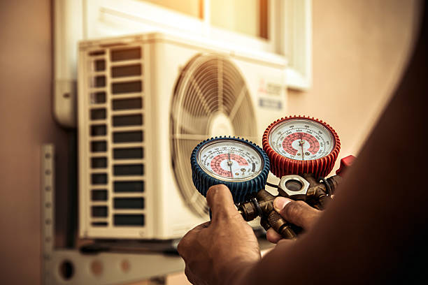 Professional Air Conditioning Service technician working in Lockport, KY
